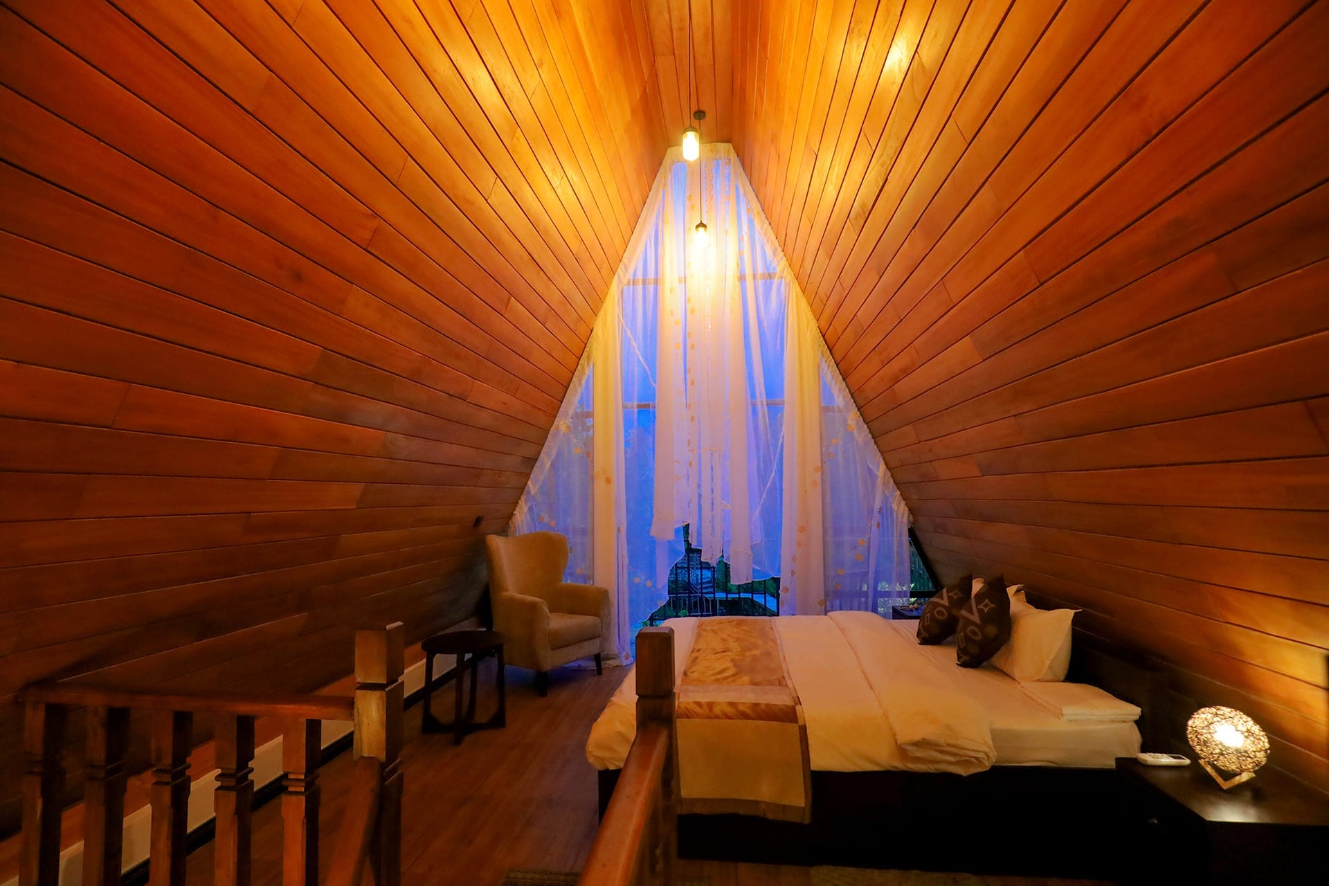 Premium Chalet Suite — A-frame interior with vaulted wooden ceiling