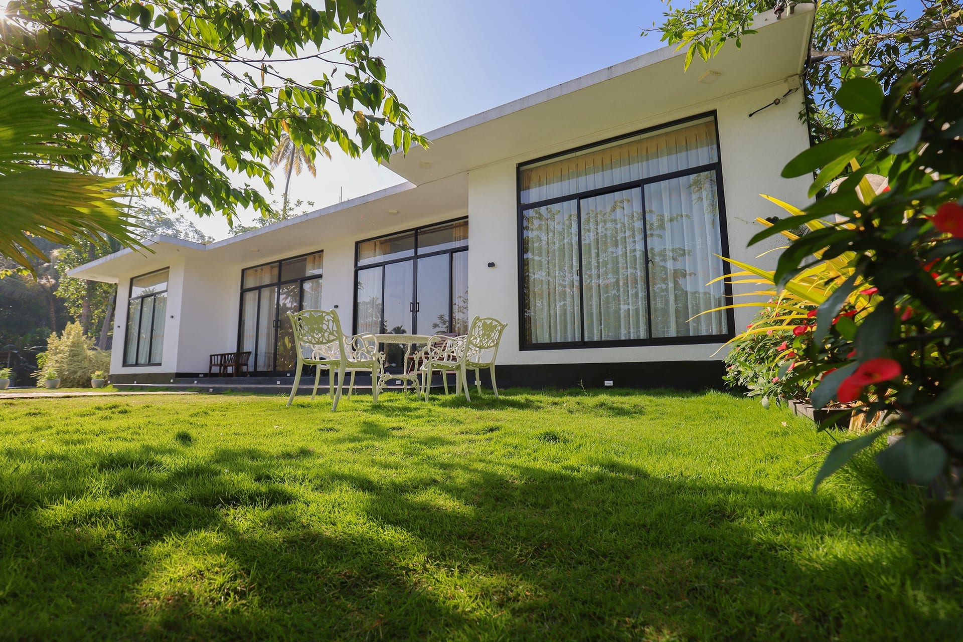 Garden suite with lush tropical garden and flowers in bloom