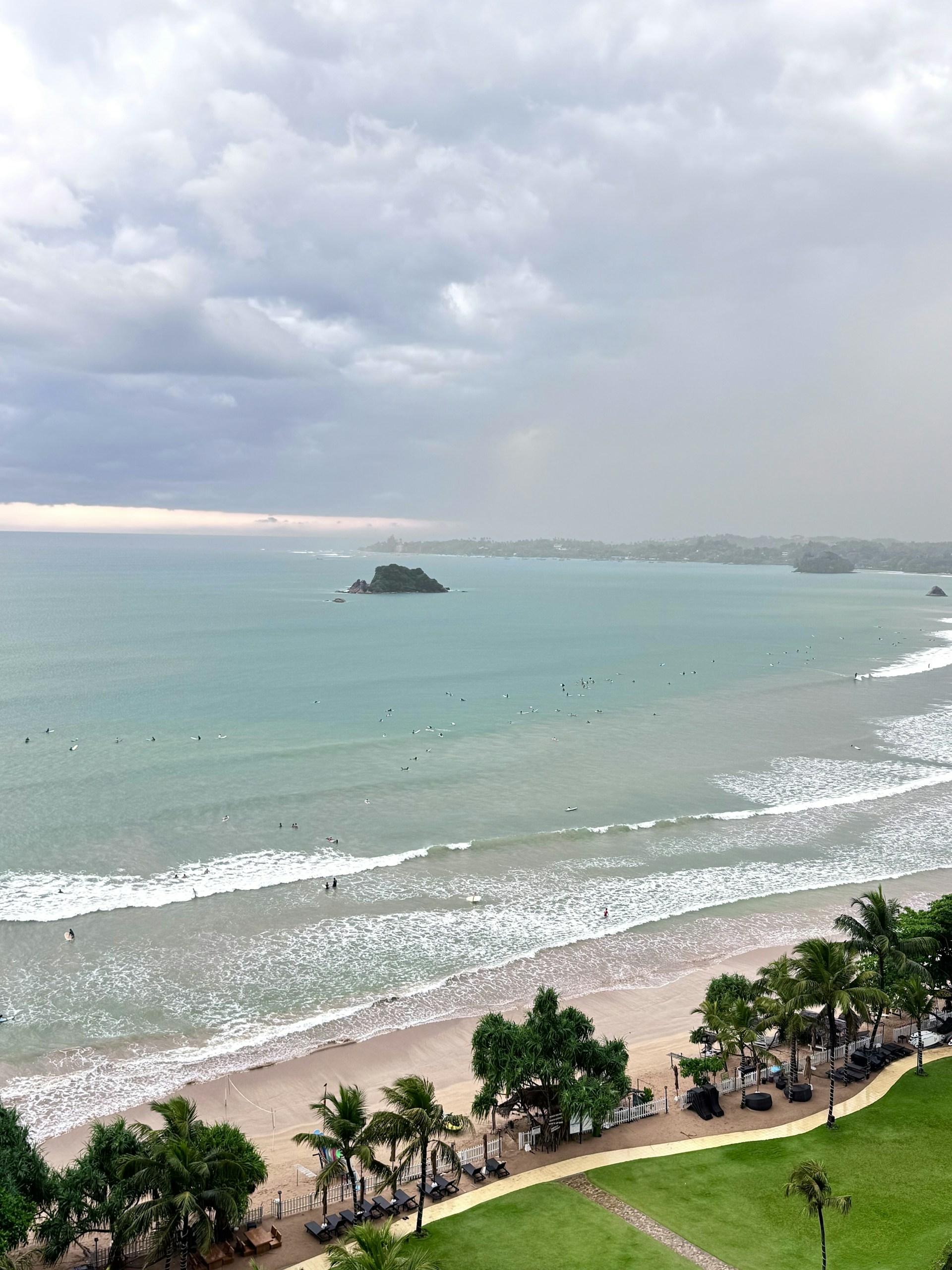 Weligama Bay — light blue water and open sky along Sri Lanka's southern shore